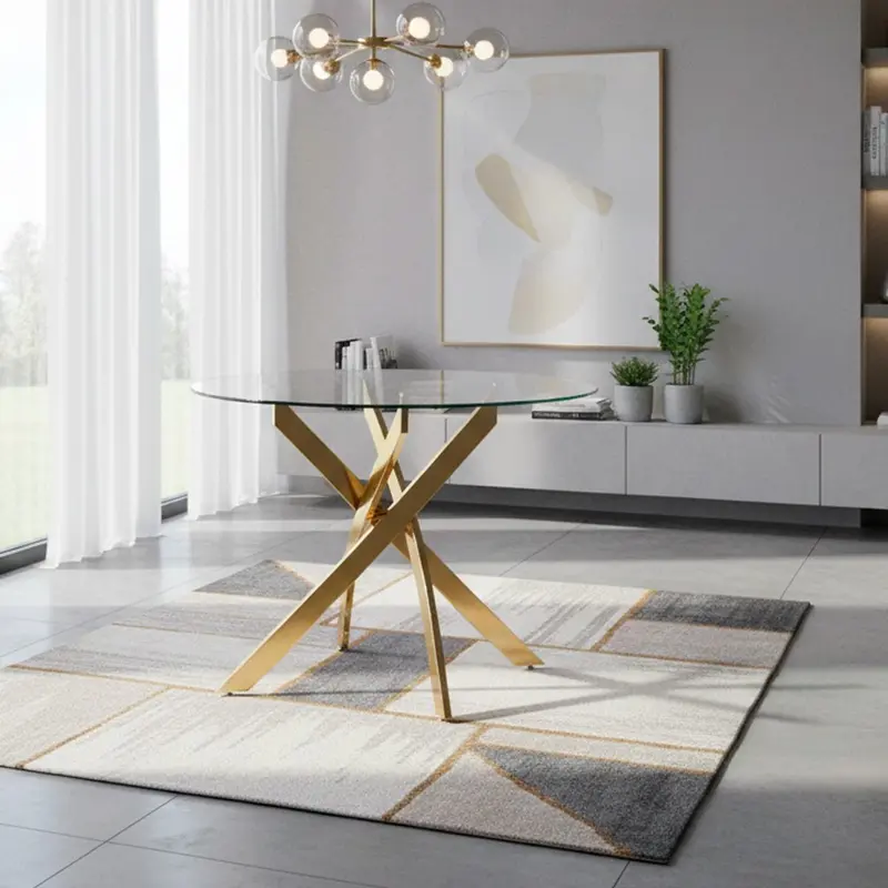 Tavolo da pranzo tondo fisso Peyton con piano in vetro temperato e gambe oro 100x100 cm.